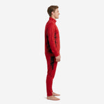 Custom red soccer tracksuit left side view showing Jet Black splash panel running from jacket underarm to pant leg