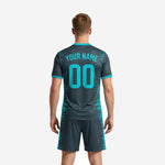 Close detail of custom teal charcoal sublimated soccer jersey with team name and number print zones