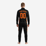 Close detail of tiger camo orange and black soccer tracksuit jacket showing stand collar, full zip, and chest print zones