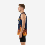 Left side view of custom navy and gold basketball jersey showing flame print wrapping the full lower panel with no side seam break