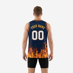 Right side view of sublimated navy and gold basketball jersey with orange V-neck binding and orange armhole trim visible at shoulder