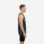 Front view of custom navy and gold basketball jerseys showing gold armhole binding, halftone shoulder pattern, and bold front number
