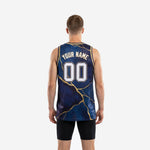 Opposite side view of custom navy and gold basketball jerseys showing athletic cut, straight hem, and full gold marble sublimation detail