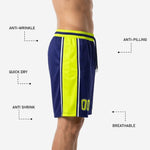 Back view of custom navy basketball shorts with neon gold side panels showing the hem line and side split at each leg opening for range of motion