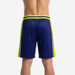 Close side detail of navy and gold basketball shorts highlighting the white pinstripe trim where the neon yellow-gold side panel meets the navy body fabric