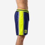 Side view of custom navy and gold basketball shorts showing full-length neon yellow-gold leg panel framed by white stripes running from waistband to hem