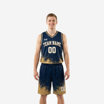 Custom navy and gold basketball uniforms with sublimated splash design, arced team name, and matching shorts - full set front view