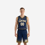 Custom navy and gold basketball uniforms full set showing sublimated jersey with gold chevron panels and matching dot-fade shorts, front view