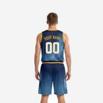 Opposite side view of navy and gold basketball uniform set showing star-field pattern across the shorts leg panel
