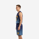 Side view of custom navy and gold sublimated basketball uniform showing V-neck jersey and matching pinstripe shorts