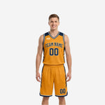 Gold side of the reversible basketball uniform showing navy chevron shoulder and leg panels with team name and number 00 in navy