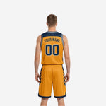 Opposite side view of the custom navy and gold reversible basketball uniform displaying panel alignment and armhole binding detail
