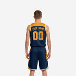 Side view of the navy and gold reversible basketball uniform showing chevron panel construction along the jersey and shorts seam