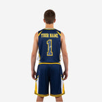 Opposite side view of navy and gold youth basketball uniform set displaying gold accent panel on jersey shoulder and shorts side panel construction