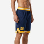 Side view of custom navy basketball shorts showing gold chevron side split at hem and ribbed gold waistband with white stripe
