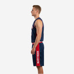 Opposite side view of navy basketball uniform set with red panel on shorts and matching striped waistband detail