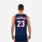 Opposite side view of navy blue basketball jersey displaying open-knit white side panel and hip-length hem with side vent
