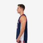 Side view of custom navy blue basketball jersey showing white contrast side panel and red armhole binding detail