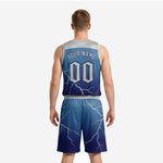 Back view of the navy blue basketball uniform with player number and name printed in white with silver outline across the full-sublimation lightning design