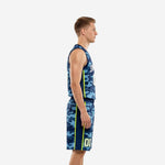 Custom navy blue basketball uniform front view with arched team name and number 00 in neon yellow-green on a two-tone camo jersey and matching shorts