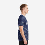 Left side view of men's custom blue and white soccer jersey showing full marble pattern across short sleeves and body