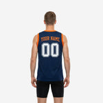 Side view of navy custom basketball jersey showing clean athletic cut and orange armhole binding wrapping the full armhole edge