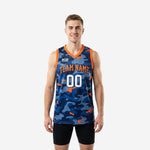 Navy custom basketball jerseys in navy and orange camo pattern, showing front view with arced team name and number 00 on adult male model