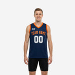 Navy custom basketball jerseys with orange V-neck binding and arced team name on chest, front and back view of fully sublimated men's game jersey