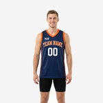 Navy custom basketball jerseys with orange V-neck binding, orange side stripe, and arced team name across the front chest in collegiate font