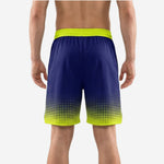 Back view of custom navy and gold basketball shorts showing the solid navy body and neon gold waistband with elastic drawcord