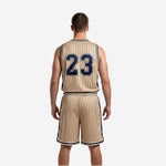 Back view of gold and navy sublimated basketball uniform showing back number and name placement on sleeveless jersey