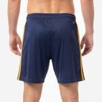 Close-up of elastic waistband on custom navy and gold soccer shorts showing ribbed finish and deep navy body fabric