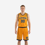 Gold side of custom reversible basketball uniform with navy hex pattern on shoulders and matching gold shorts with navy hem trim, front view