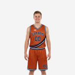 Custom navy and gold reversible basketball uniforms orange side front view with diagonal slash accent and bold team name and number