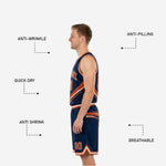 Shorts detail of orange and navy reversible basketball uniform set showing double white hem stripe elastic waistband and drawcord