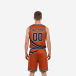Side view of orange and navy reversible basketball uniform showing V-neck binding bound armholes and matching shorts side panel