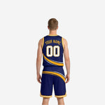 Side view of the navy and gold reversible club basketball uniform showing armhole binding and swoosh stripe continuing from jersey to shorts