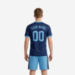 Close detail of V-neck collar and sleeve cuff trim on custom navy blue soccer jersey with light blue contrast binding