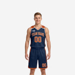 Front view of custom navy and orange reversible basketball uniform with team name, number, and diagonal slash side panel detail