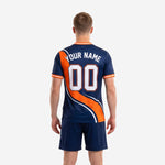 Back view of navy blue and orange custom soccer uniform kit with player name and number sublimated on jersey