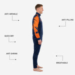 Navy blue tapered soccer tracksuit pants with orange player number on thigh, part of the custom 2-piece sublimated set