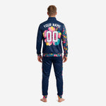 Close detail of navy soccer tracksuit jacket showing stand collar, full-zip front, and floral cuff print