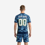 Close detail of navy blue camo sublimated soccer jersey with v-neck collar and neon yellow trim