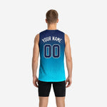 Right side view of the custom sublimated basketball jersey in navy and teal showing armhole binding and hex gradient detail