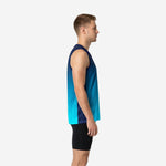 Adult male wearing a navy-to-teal custom sublimated basketball jersey with hexagon pattern and arced team name across the chest