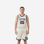 Front view of custom navy and white reversible basketball uniform with contour-line topographic pattern across jersey and matching shorts