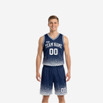 Navy and white reversible basketball uniforms front view showing halftone dot fade pattern on navy side jersey and matching shorts with white number 00