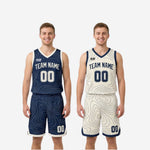 Full set view of navy and cream-white reversible basketball uniform showing jersey and matching shorts together on court