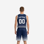 Side view of the navy and white reversible basketball uniform showing armhole binding and sleeveless athletic cut on adult male model
