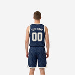 Side view of navy reversible basketball jersey showing bound armhole edge and V-neck collar with cream-white trim binding